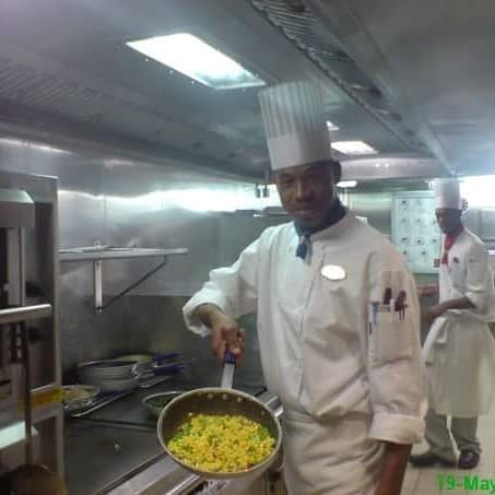 Brian Maylor in the galley, sautéing corn and peppers — Royal Caribbean kitchen years