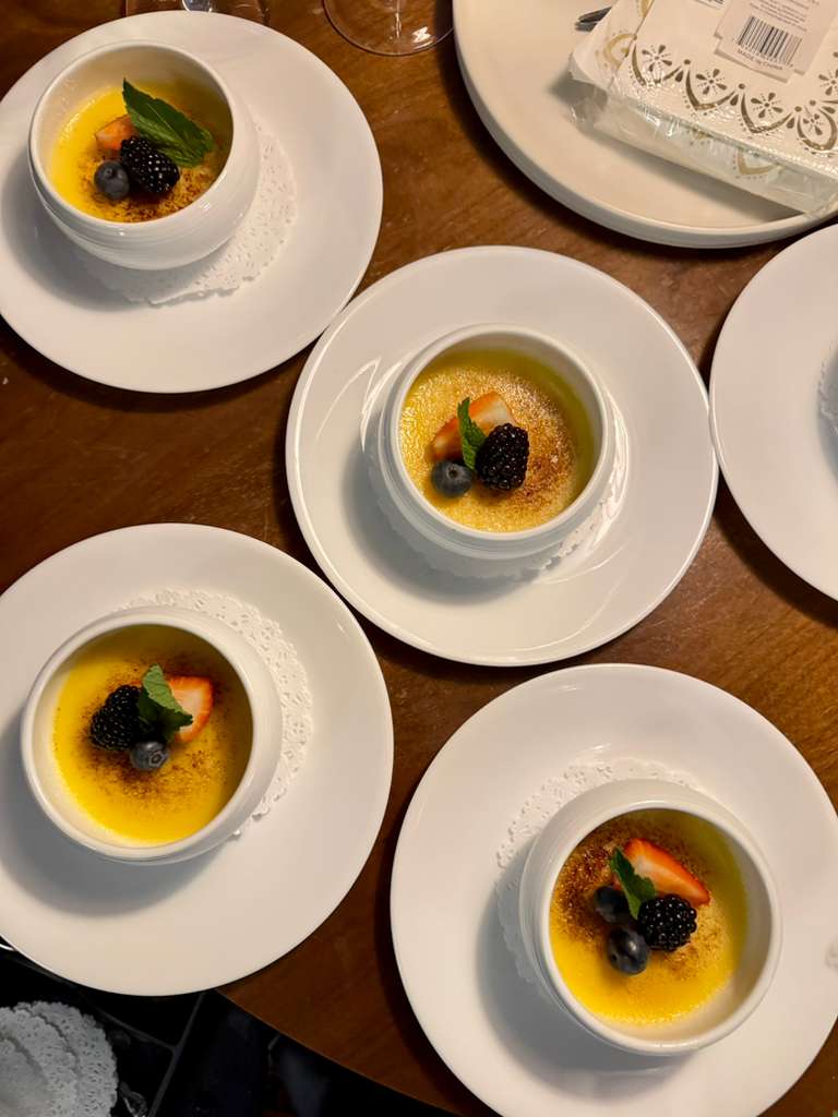 Bornfidis crème brûlée dessert course served at a private dining table