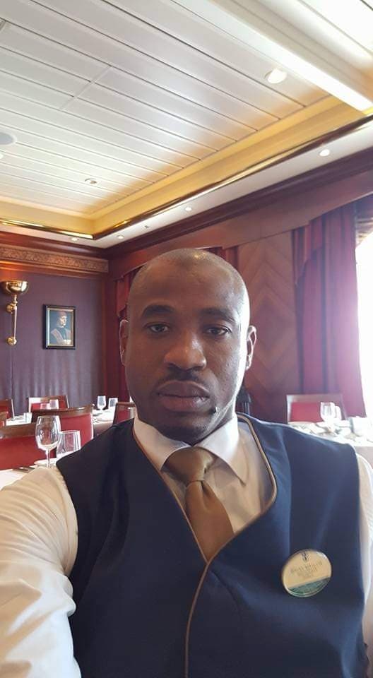 Brian Maylor in Royal Caribbean Azamara service vest — luxury tier credentials